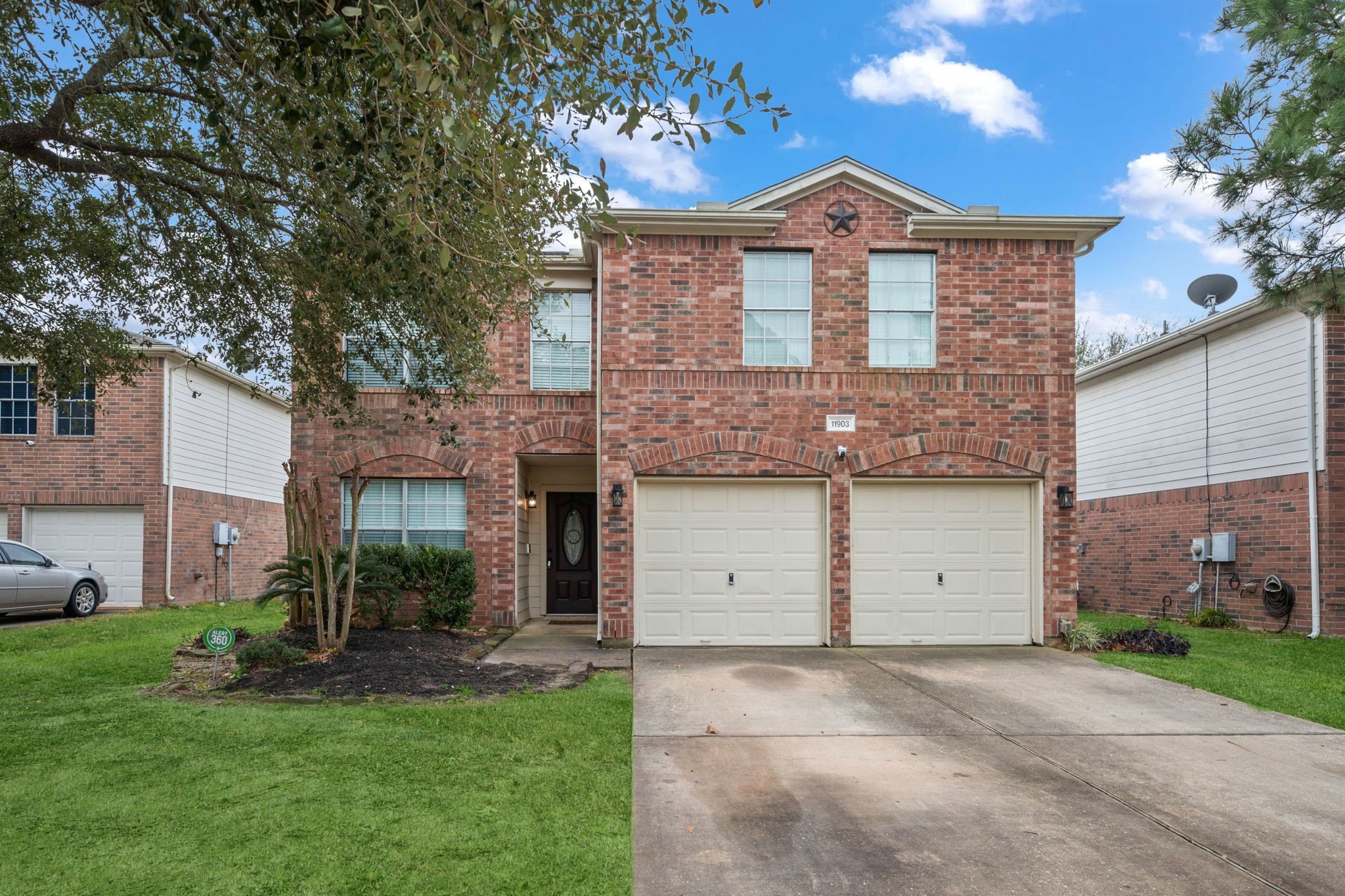 11903 Ezekiel Road Tomball, TX 77375 - Photo 1 of 40 a front view of a house with a garden and plants