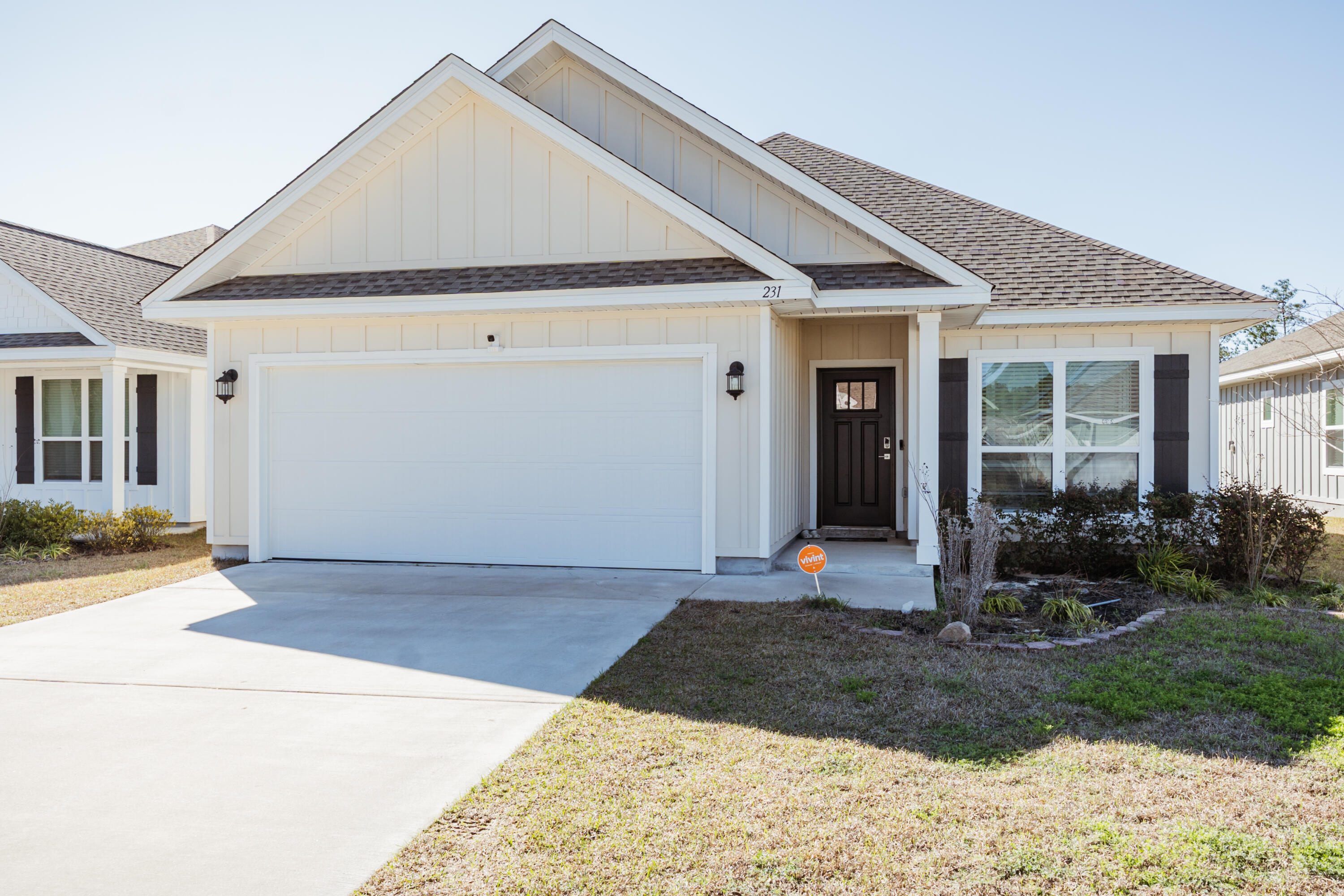 a front view of a house with garden