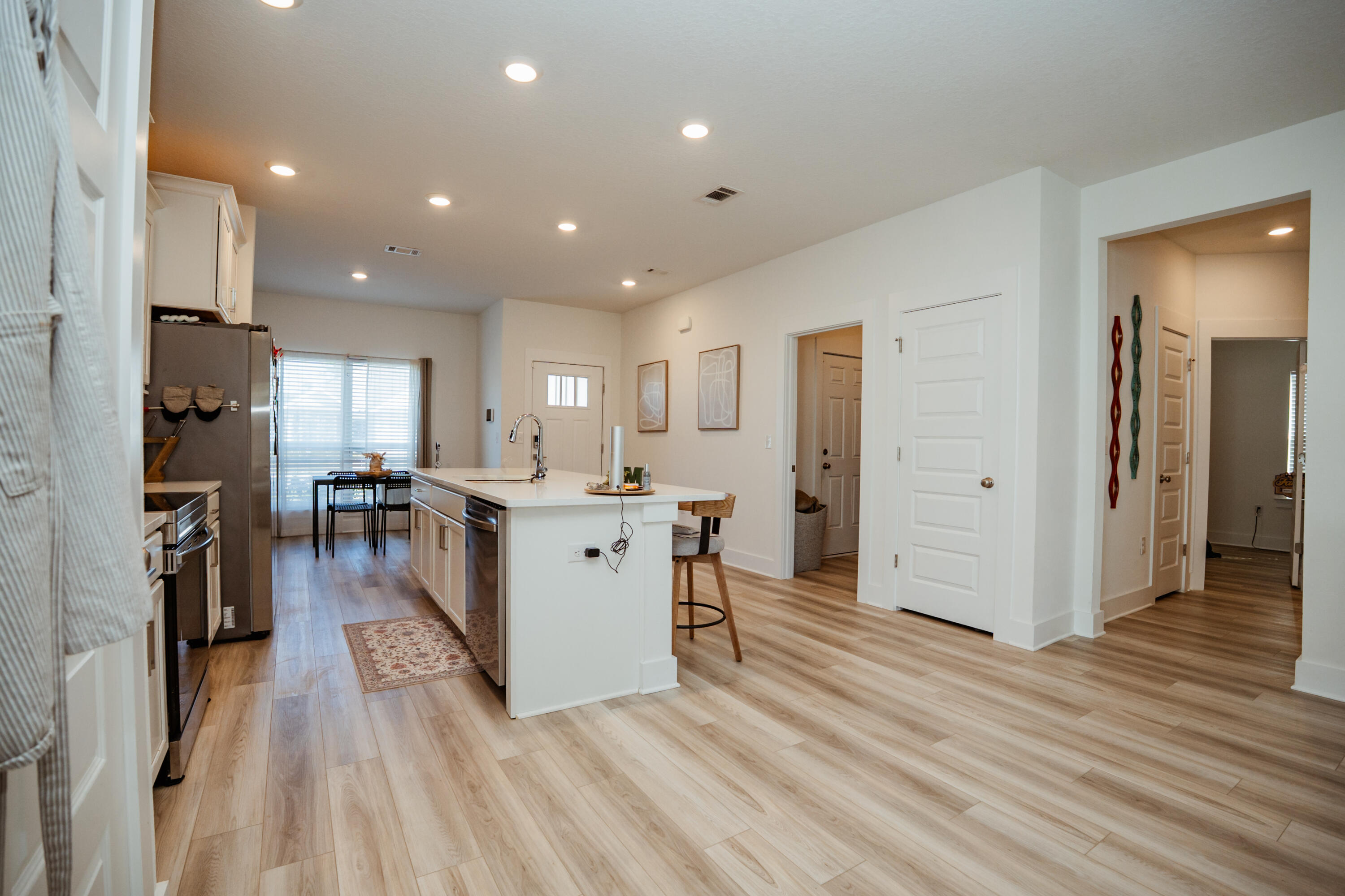 231 Lyla Lane Crestview, FL 32539 - Photo 11 of 27 a view of a kitchen with furniture and wooden floor