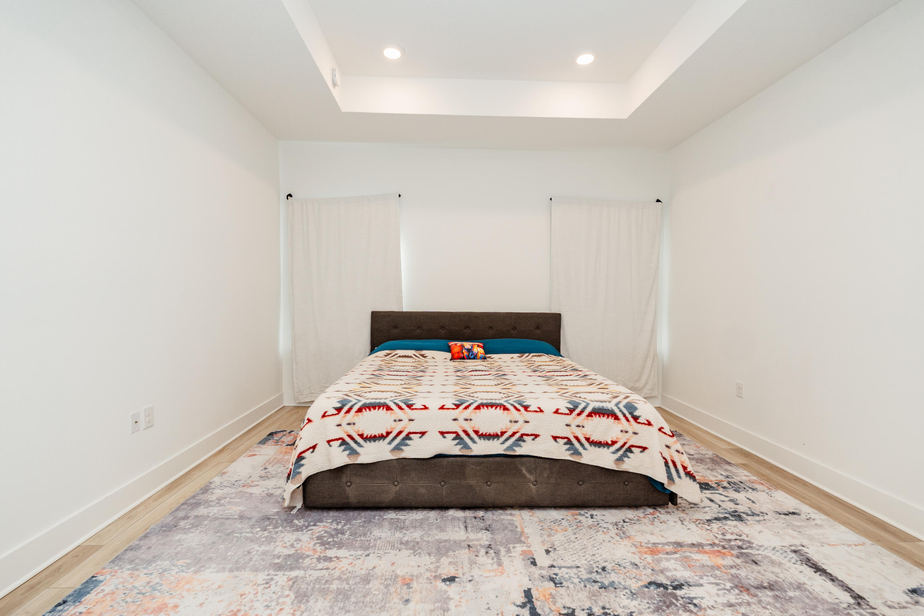 231 Lyla Lane Crestview, FL 32539 - Photo 20 of 27 a bedroom with a bed and a wooden floor