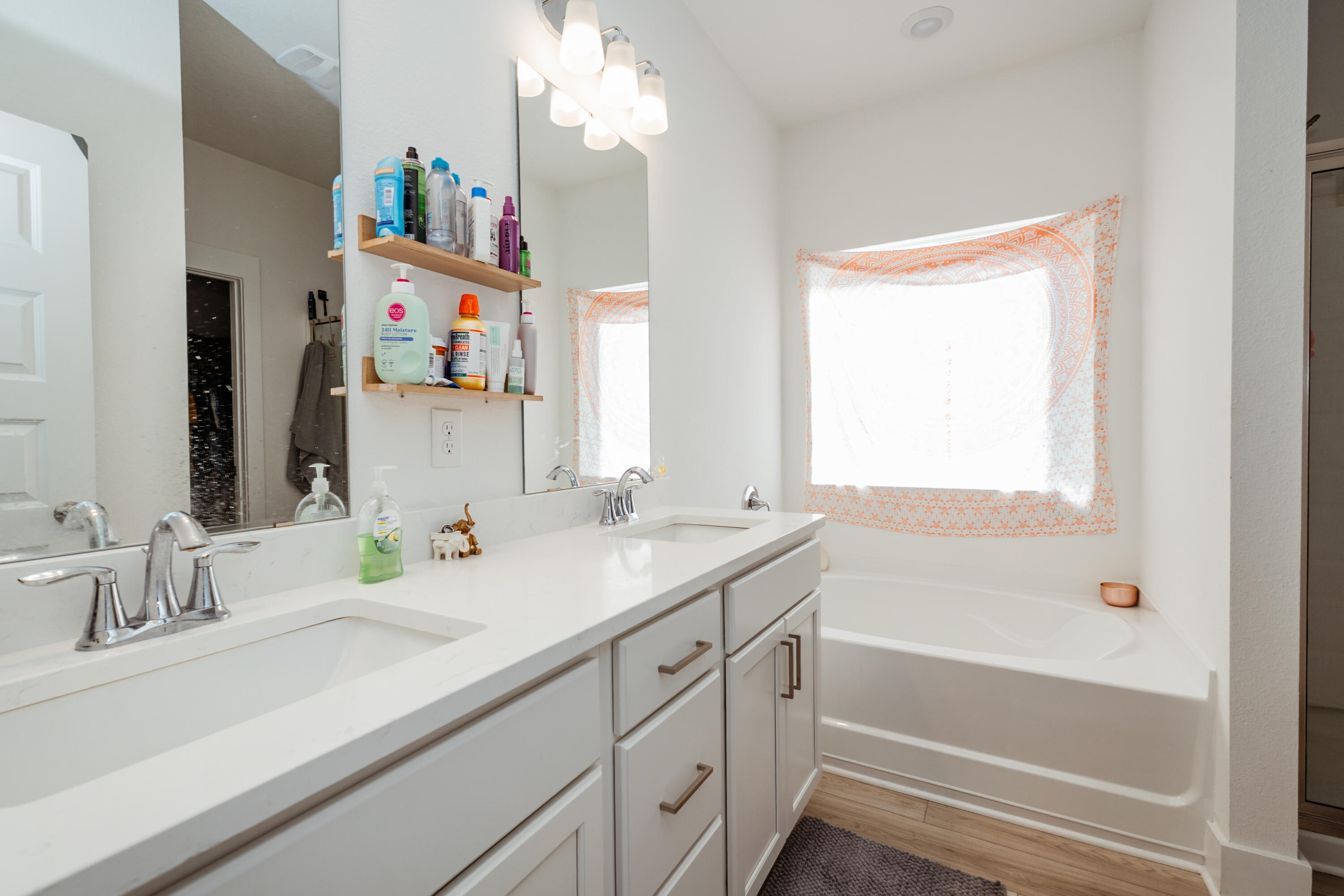 231 Lyla Lane Crestview, FL 32539 - Photo 21 of 27 a bathroom with a sink vanity tub and a mirror