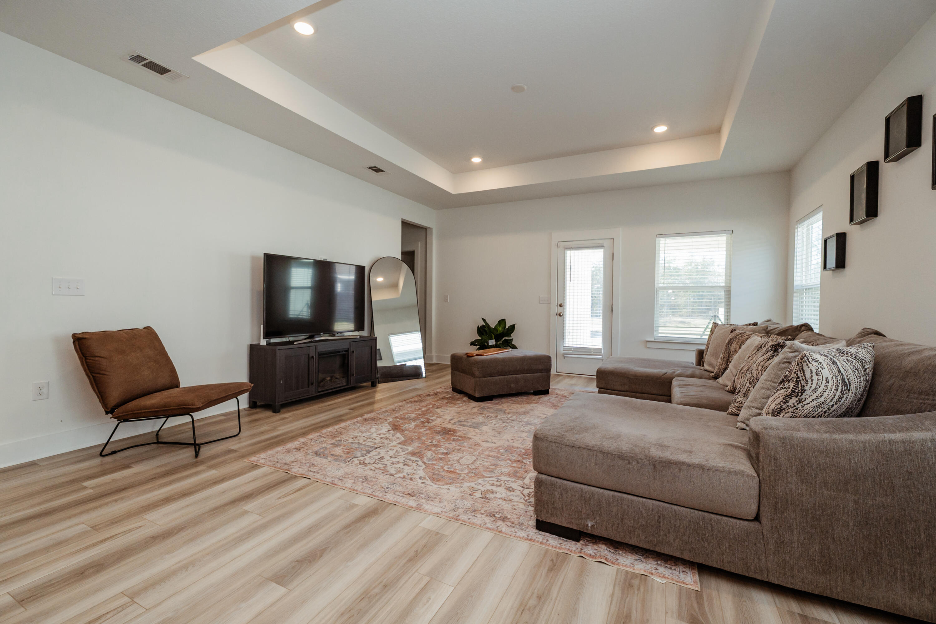 231 Lyla Lane Crestview, FL 32539 - Photo 6 of 27 a living room with furniture and a flat screen tv