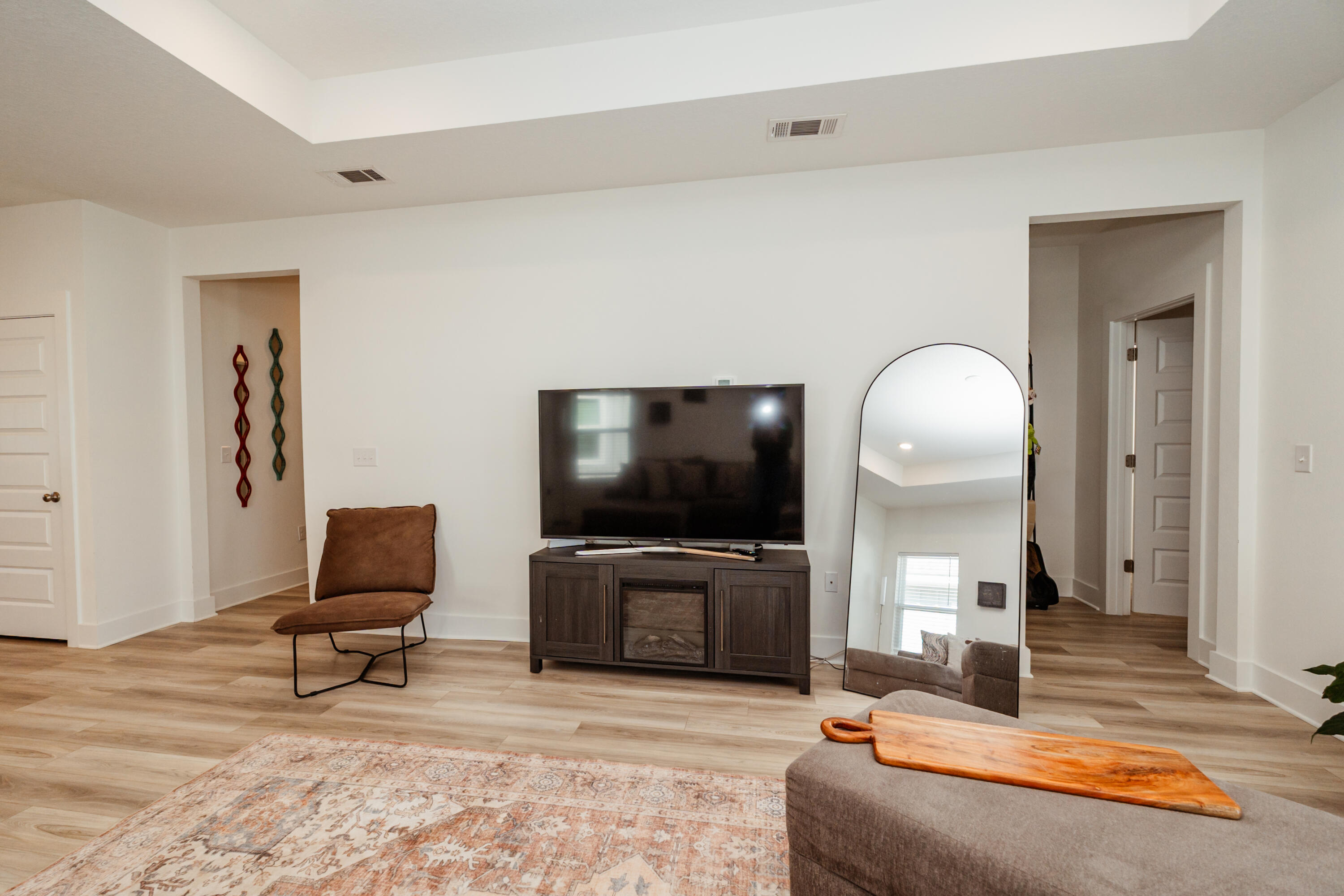 231 Lyla Lane Crestview, FL 32539 - Photo 9 of 27 a living room with furniture and a flat screen tv