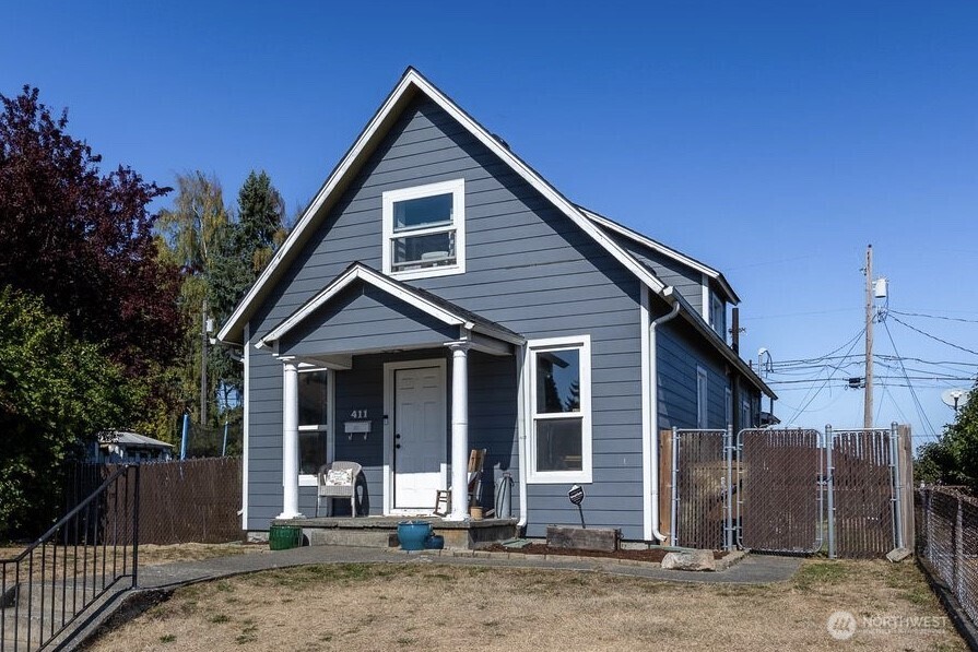 a front view of a house with garden