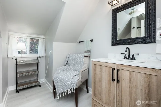 a bedroom with a bed and a mirror