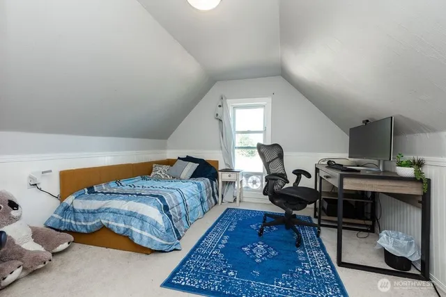 a living room with furniture and a rug