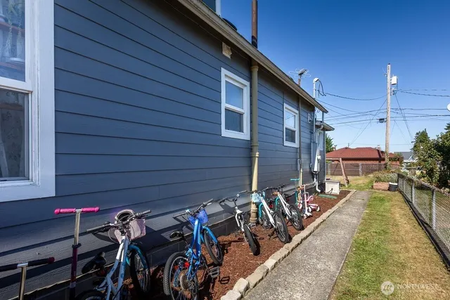 a view of a patio with wooden wall