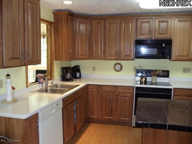 6533 Taylor Road Painesville, OH 44077 - Photo 10 of 25 YOU WILL LOVE THIS KITCHEN WITH PLENTY OF CABINETS FOR STORAGE AND COUNTER SPACE.