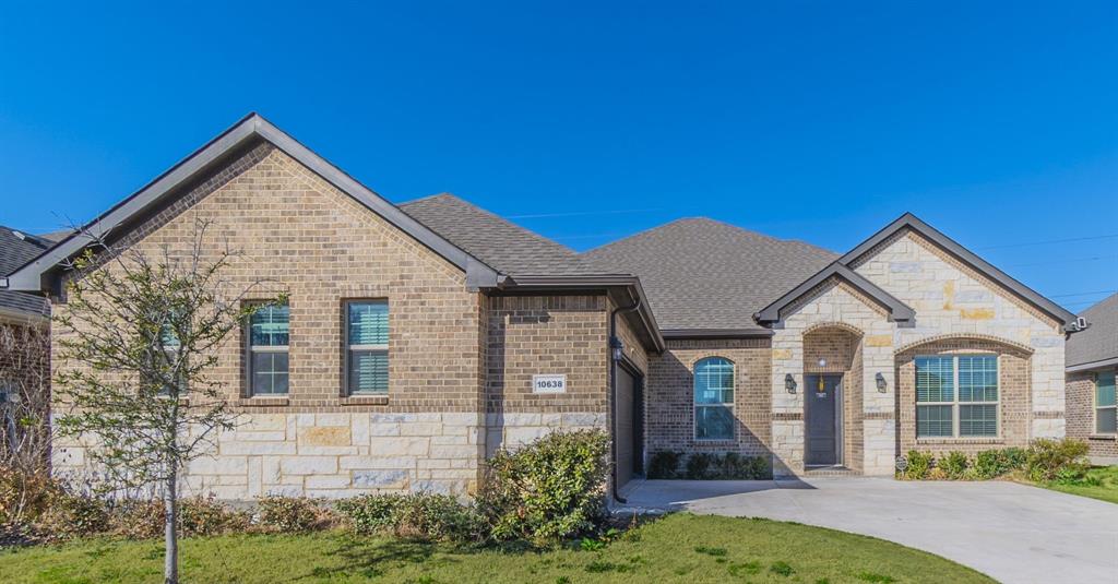10638 Cherry Tree Way front of home with driveway and yard
