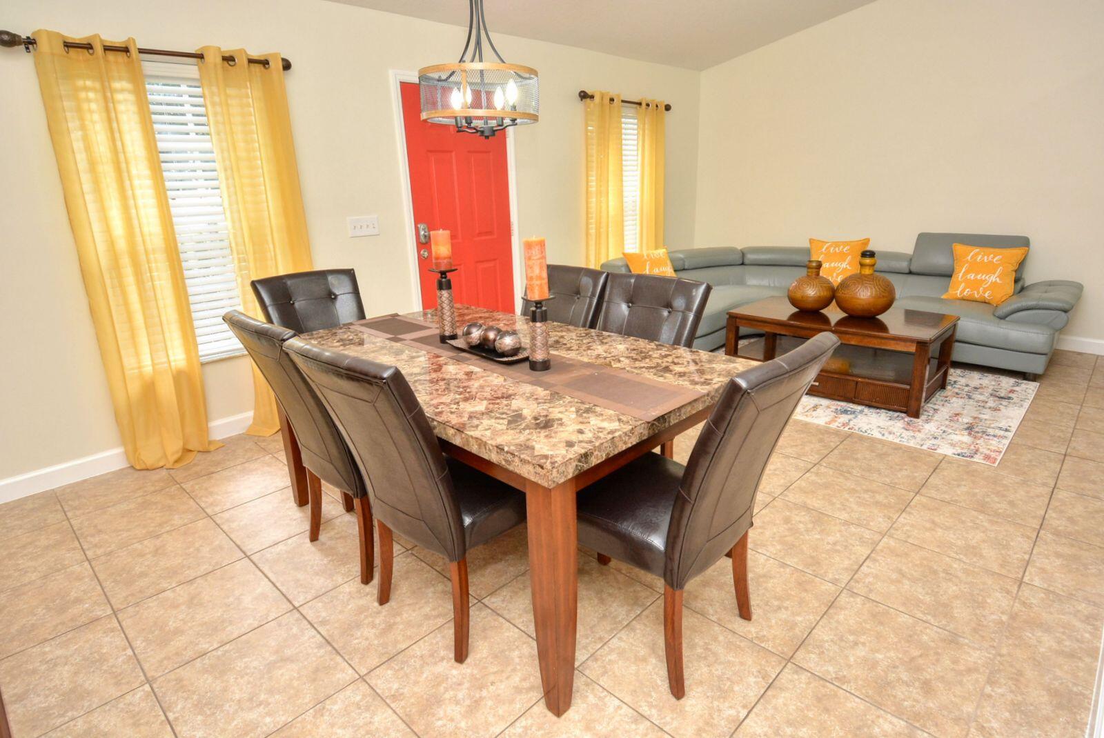 220 West Arbor Avenue Port St. Lucie, FL 34952 - Photo 3 of 32 a view of a dining room with furniture and a window
