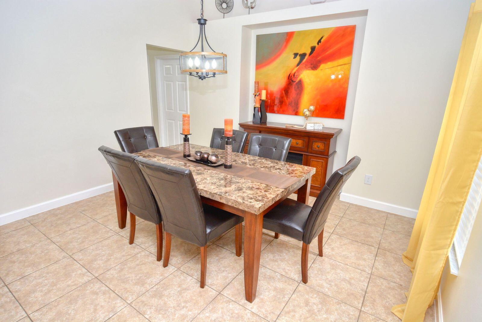 220 West Arbor Avenue Port St. Lucie, FL 34952 - Photo 5 of 32 a view of a dining room with furniture and wooden floor