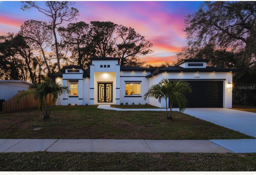 15364 Newport Road Clearwater, FL 33764 - Photo 2 of 50 a front view of a house with a yard