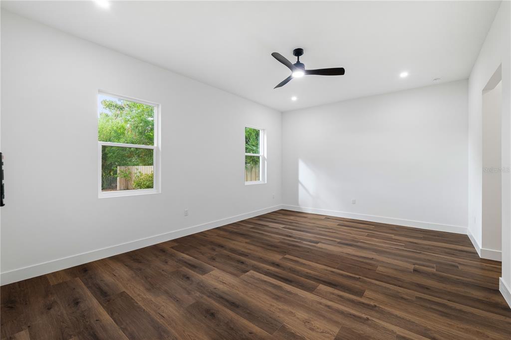 15364 Newport Road Clearwater, FL 33764 - Photo 35 of 50 a view of empty room with wooden floor and fan