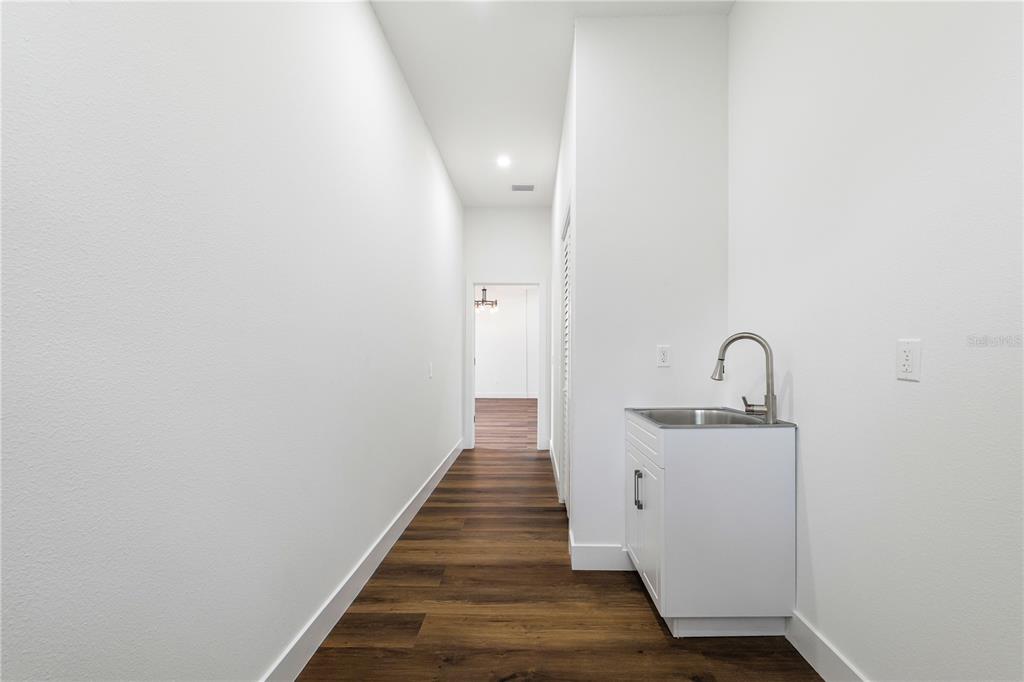 15364 Newport Road Clearwater, FL 33764 - Photo 43 of 50 a hallway with wooden floor
