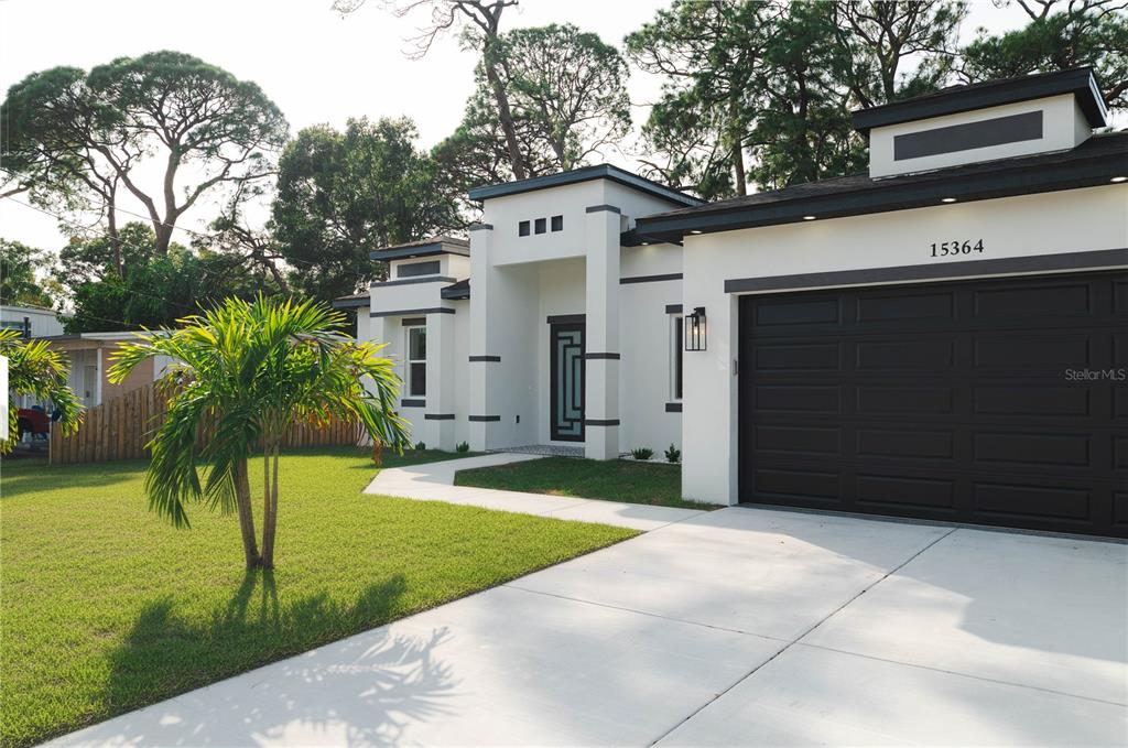 15364 Newport Road Clearwater, FL 33764 - Photo 6 of 50 a front view of a house with garden