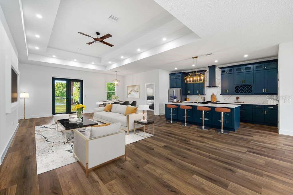 15364 Newport Road Clearwater, FL 33764 - Photo 7 of 50 a living room with furniture kitchen view and a wooden floor