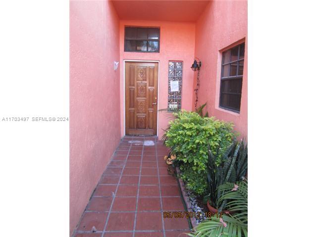 20820 San Simeon Way, Unit 26G Miami, FL 33179 - Photo 3 of 6 a front view of a house