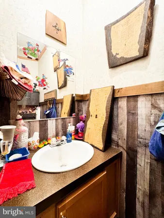 a view of a dining room with furniture and a mirror