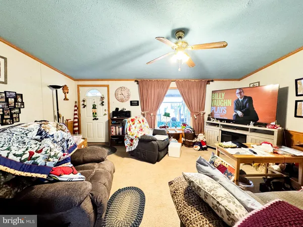 a bedroom with furniture and a large window