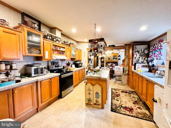 a large white kitchen with lots of counter top space