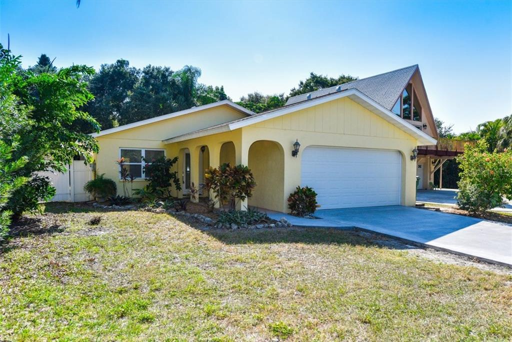 1682 Wharf Road Sarasota, FL 34231 - Photo 1 of 1 a view of a house with yard and garden