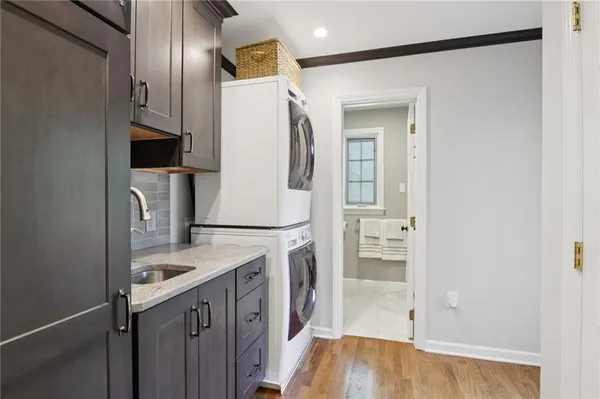 a kitchen with a refrigerator and a sink