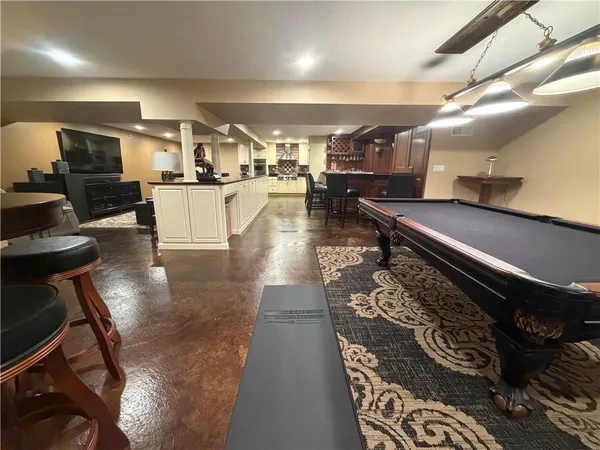 a lobby with furniture and a wooden floor