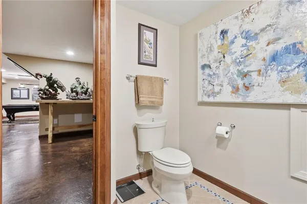 a bathroom with a sink a light fixture and a mirror