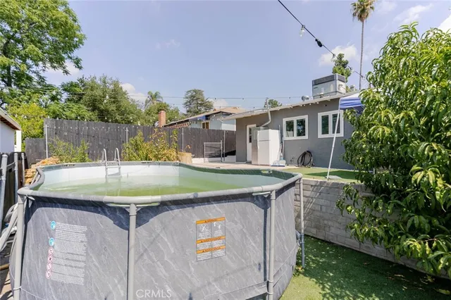 a view of a house with a sink and a yard