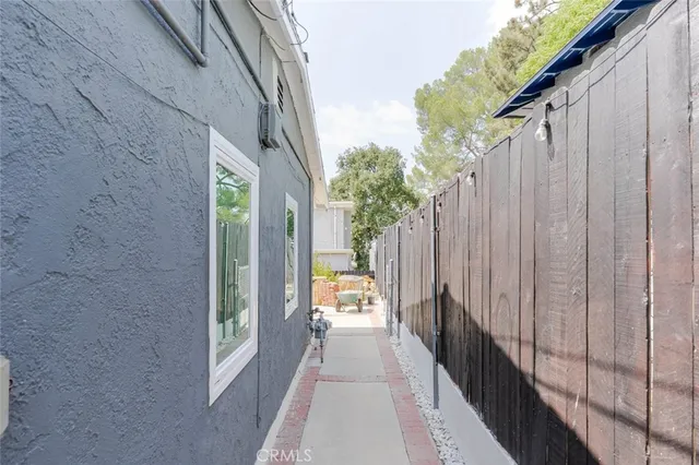 a view of a balcony with wooden floor and couch