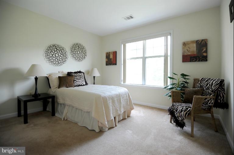 5563 Seminary Road, Unit 406 Falls Church, VA 22041 - Photo 11 of 18 a bedroom with a bed and a window