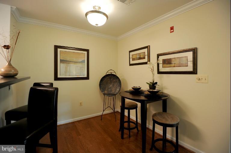 5563 Seminary Road, Unit 406 Falls Church, VA 22041 - Photo 10 of 18 a view of a workspace with furniture and wooden floor