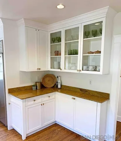 a kitchen with a sink and cabinets