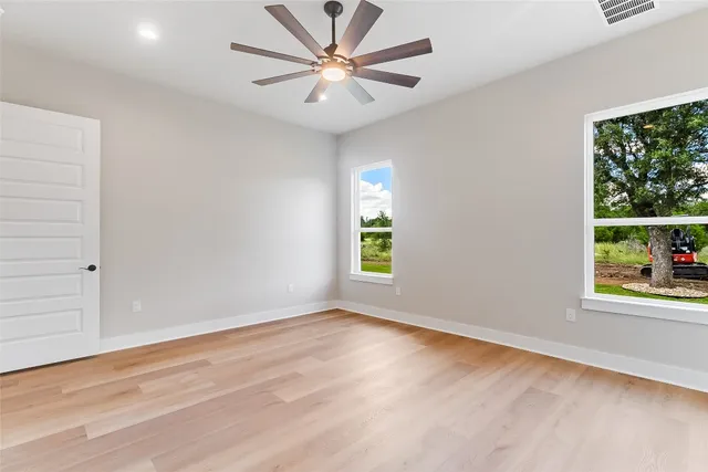a bathroom with a bathtub sink vanity and mirror