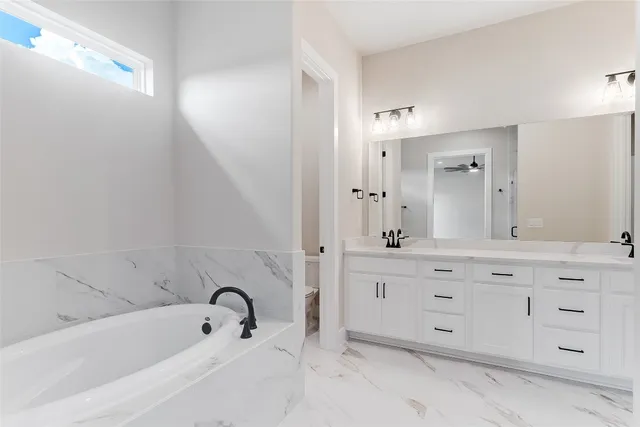 a bathroom with a double vanity sink mirror double and shower