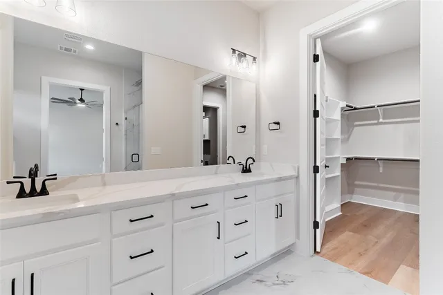 a bathroom with a bathtub and a sink
