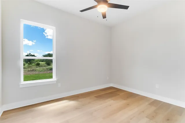 an empty room with closet area