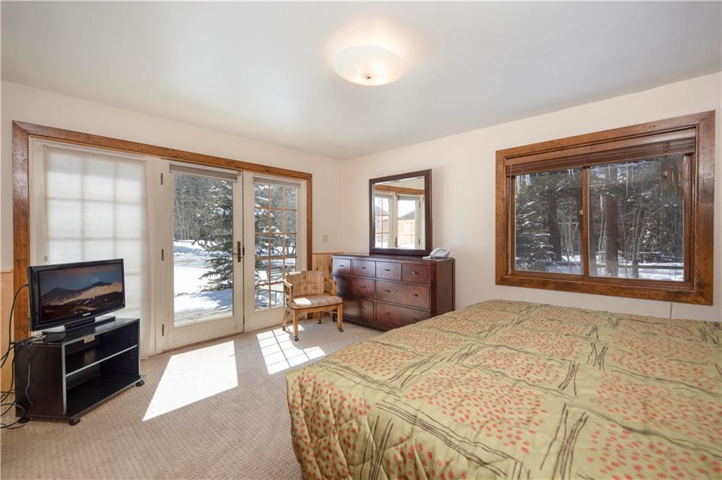 22 Keystone Gulch Road Keystone, CO 80435 - Photo 21 of 35 a bedroom with a large bed and a window