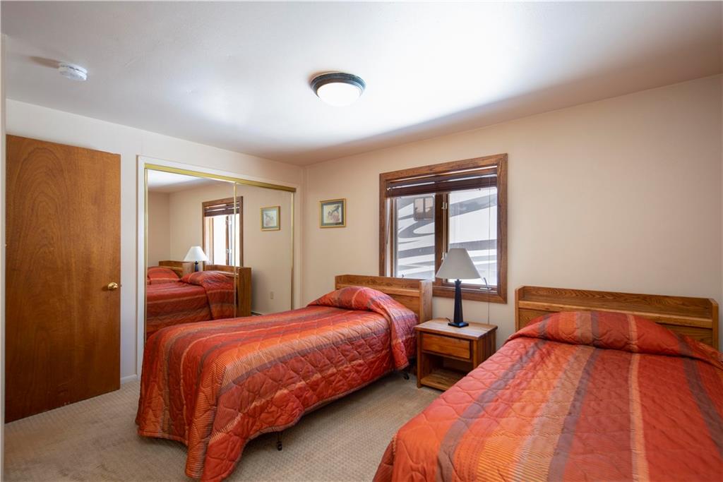 22 Keystone Gulch Road Keystone, CO 80435 - Photo 23 of 35 a bedroom with two beds and a large window