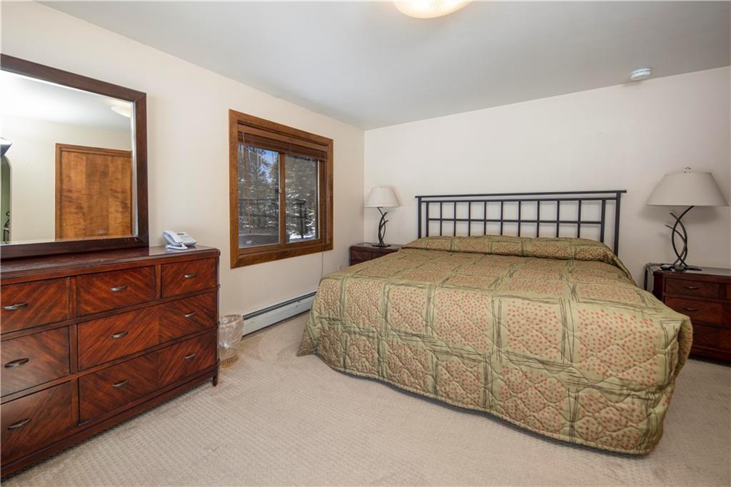 22 Keystone Gulch Road Keystone, CO 80435 - Photo 25 of 35 a bedroom with a bed and window