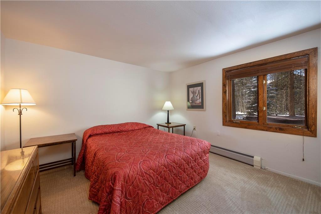 22 Keystone Gulch Road Keystone, CO 80435 - Photo 27 of 35 a bedroom with a bed and window