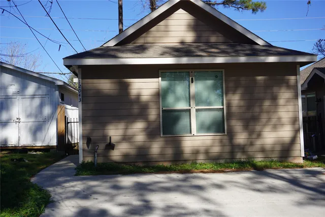 a bathroom with a glass door shower
