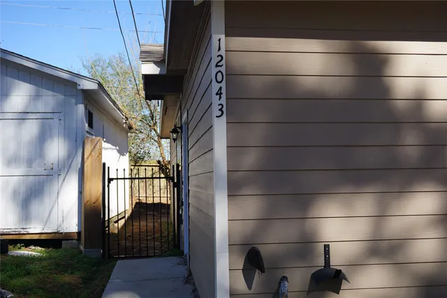 a bathroom with a glass door shower