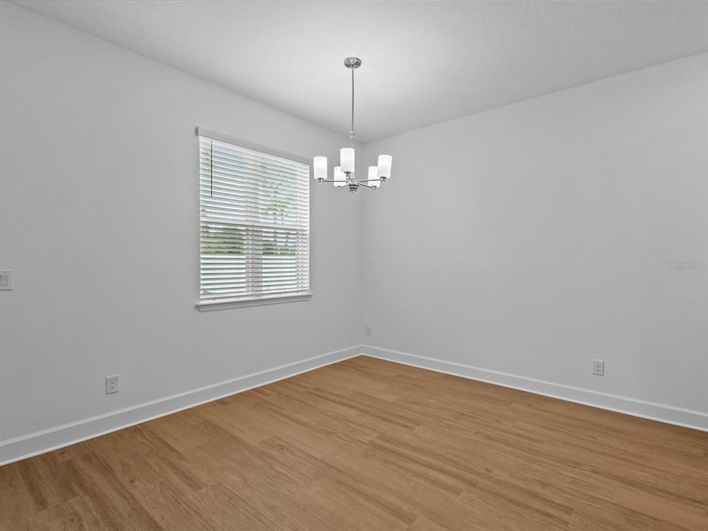 8018 Colby Circle Orlando, FL 32817 - Photo 24 of 32 wooden floor in an empty room with a window
