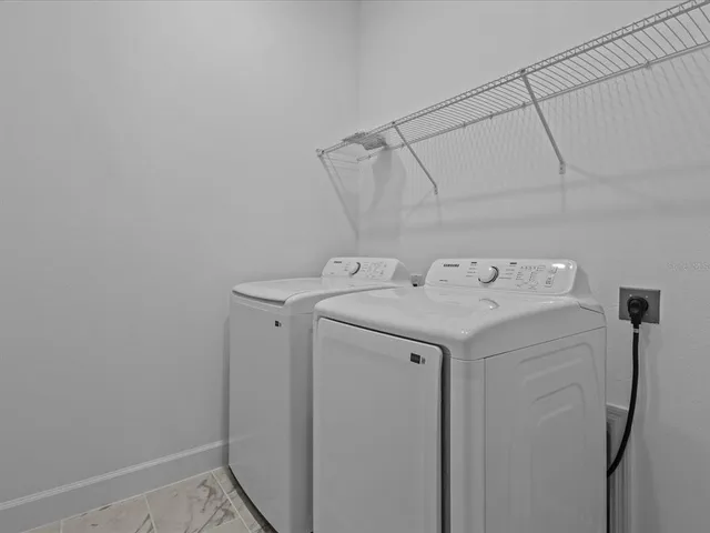 a utility room with dryer and washer