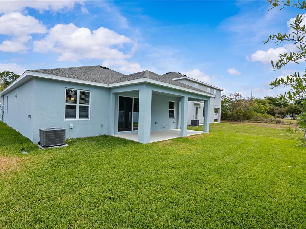 8018 Colby Circle Orlando, FL 32817 - Photo 31 of 32 a view of a house with a backyard