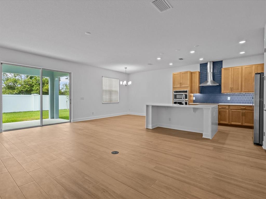 8018 Colby Circle Orlando, FL 32817 - Photo 7 of 32 a view of kitchen with wooden floor and electronic appliances
