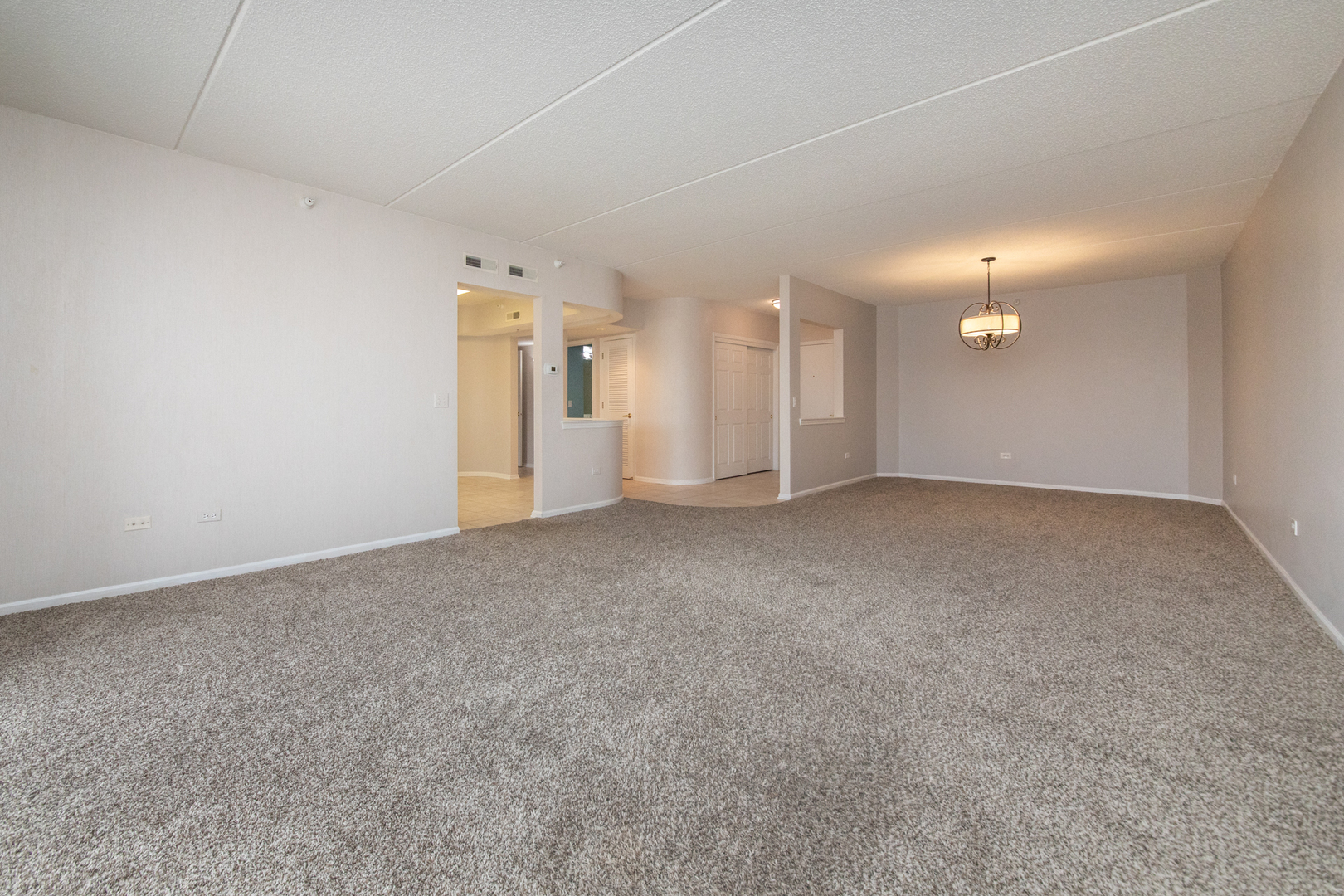 650 South River Road, Unit 601 Des Plaines, IL 60016 - Photo 6 of 20 a view of a big room with a fireplace