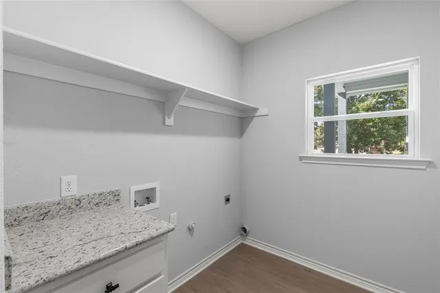 a view of a storage and utility room with washer and dryer