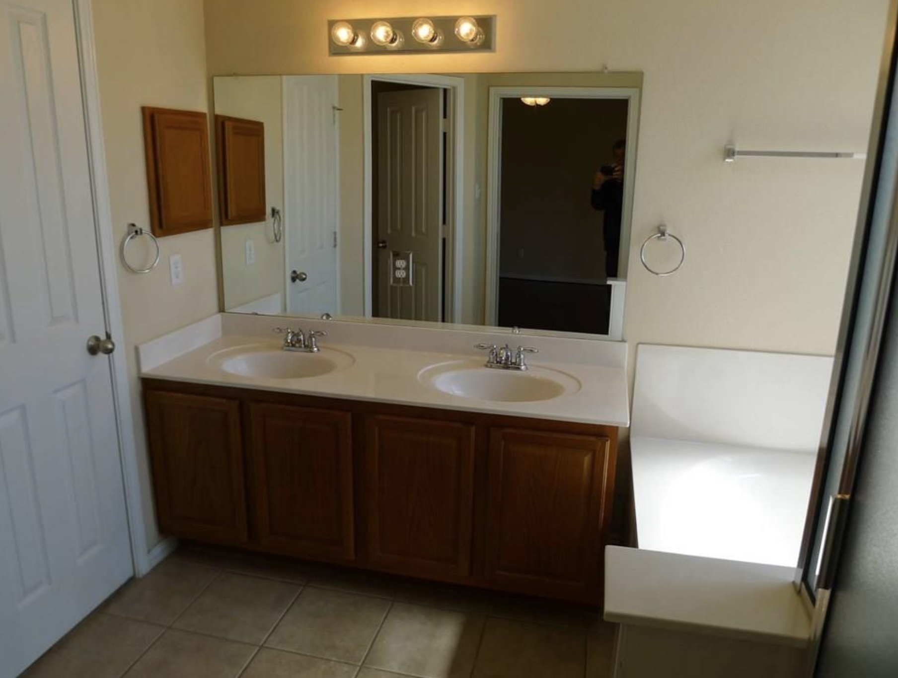 2344 Chimney Rock Road Leander, TX 78641 - Photo 13 of 14 a bathroom with a sink and a mirror